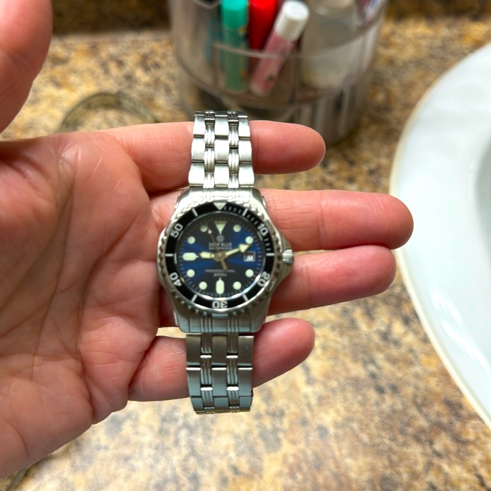 Women’s Deep Blue brand watch. 8” around, silver